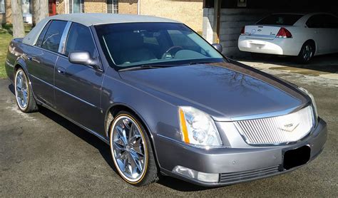 Still has the GM badge on the fender and it doesnt have the Shark Fin antenna on the roof. . Vogue tires for cadillac dts